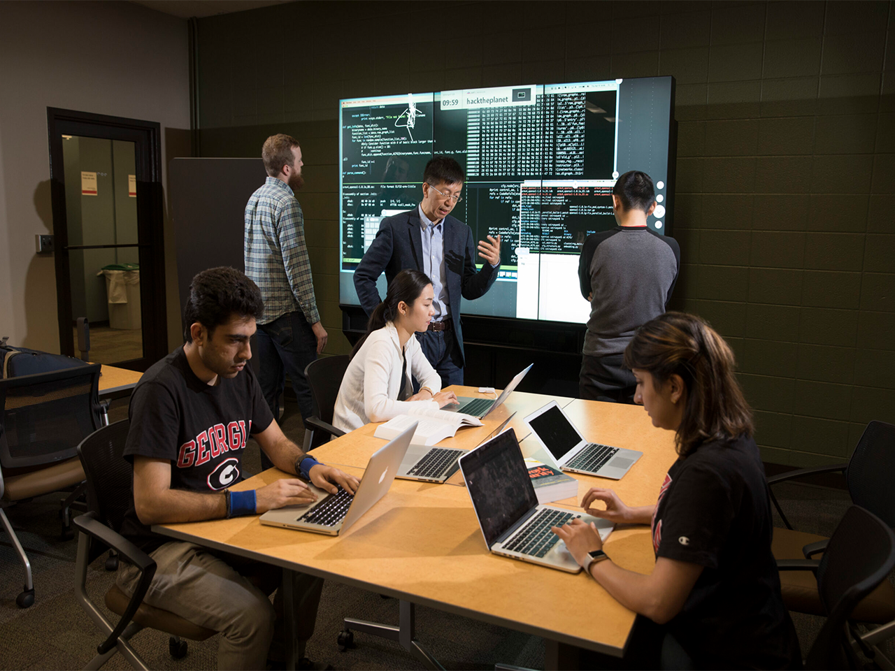An image of a professor and students in an AI class