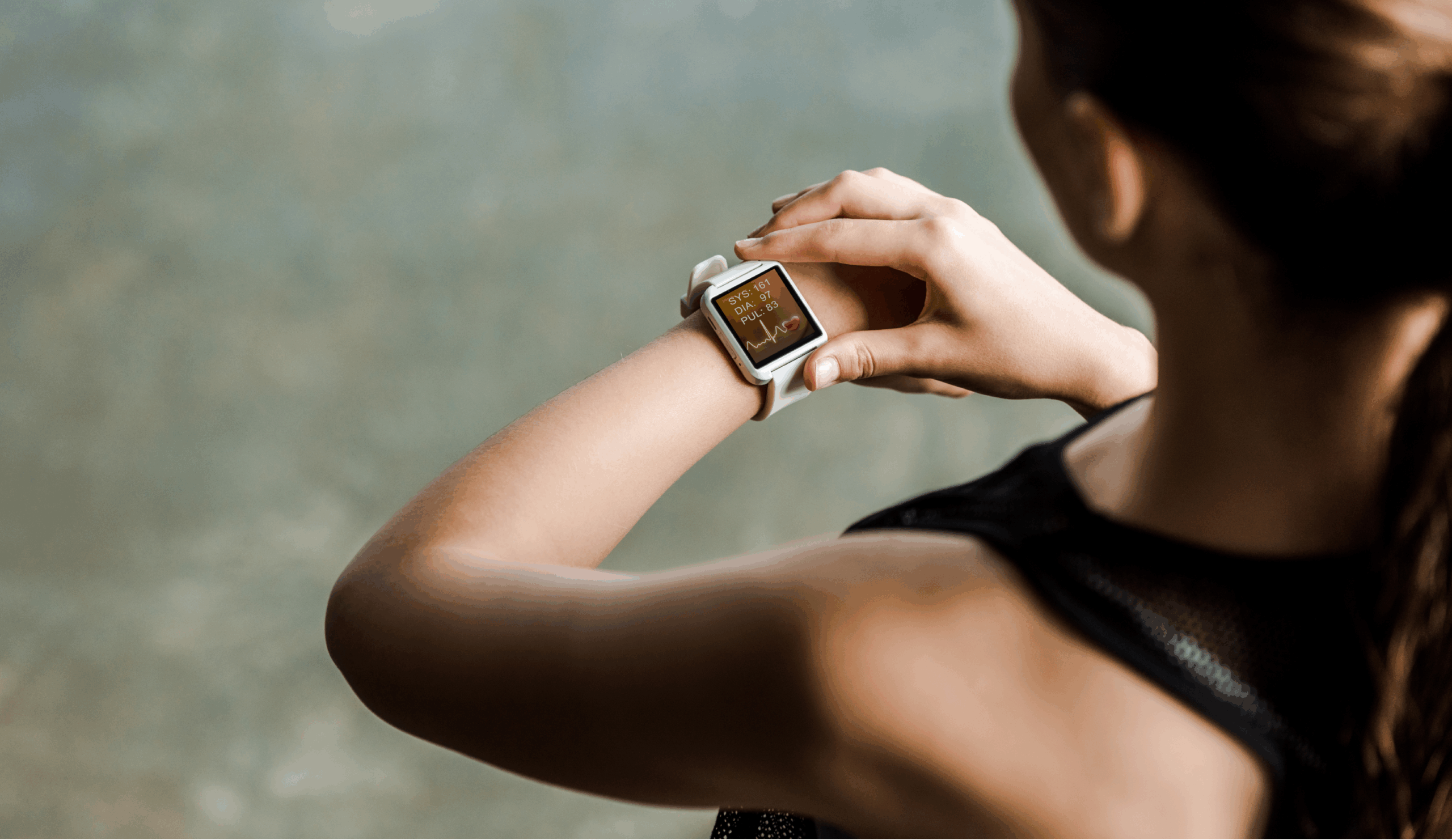 A runner checking their smart watch